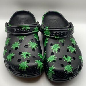 CROCS Black Sandals with Vibrant Green Leaf Pattern new never worn 
782
